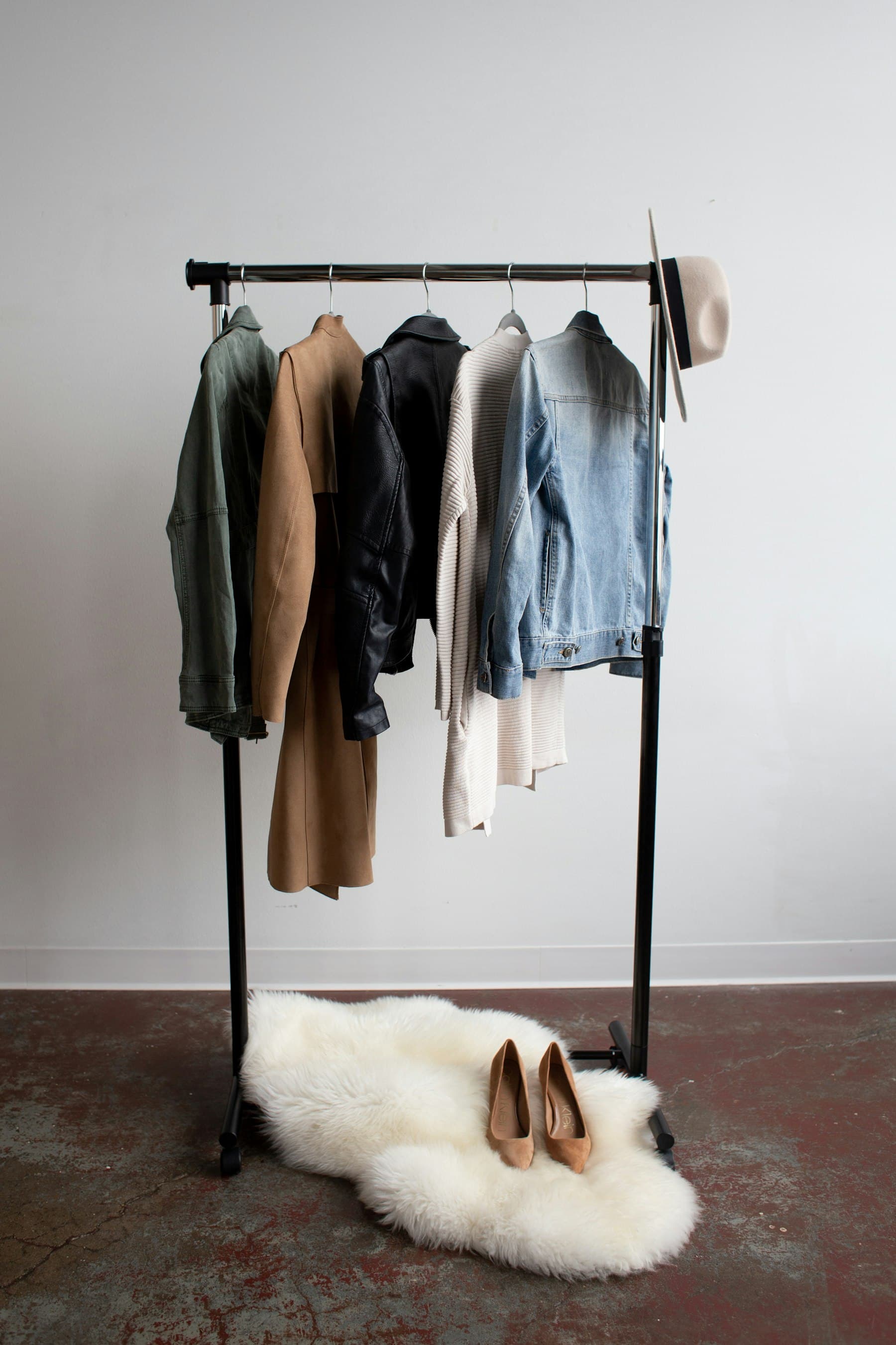 Rack of vintage denim jacket, leather jacket, and wardrobe pieces we buy from Los Angeles sellers